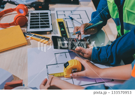 Architects and engineers working collaboratively on construction project Architects and engineers working collaboratively on construction project 133570953