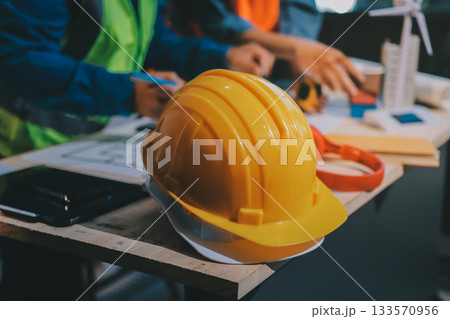 Architects and engineers working collaboratively on construction project Architects and engineers working collaboratively on construction project 133570956