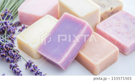 Lavender adorned handmade soap bars displaying vibrant colors and natural ingredients, evoking serene wellness and artisan skincare elegance against pristine background 133571503