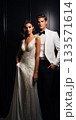 An Elegant Fashionable Bride and Groom Dressed in Stunning Evening Wear for a Special Occasion 133571614