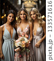 Bridesmaids dressed in elegant dresses, holding a beautiful floral bouquet 133571616