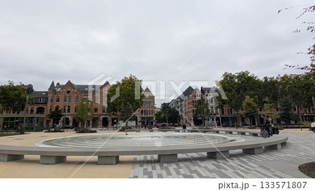 The circle bench at the park in front of European buildings in Antwerp The circle bench at the park in front of European buildings in Antwerp 133571807