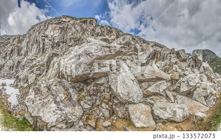 Panoramic view of rocky alpine slope and massive boulder field Panoramic view of rocky alpine slope and massive boulder field 133572073