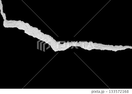 Ripped torn paper edges isolated on black background 133572168