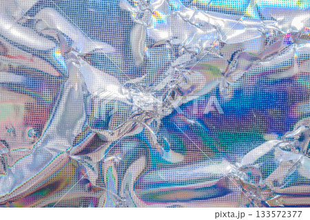 Holographic rainbow wrinkled foil iridescent texture abstract hologram background 133572377