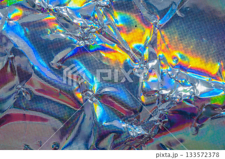 Holographic rainbow wrinkled foil iridescent texture abstract hologram background Holographic rainbow wrinkled foil iridescent texture abstract hologram background 133572378