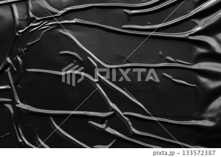 black crumpled and creased plastic poster texture background black crumpled and creased plastic poster texture background 133572387
