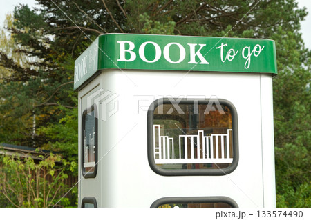 Book to go. Public street book-sharing kiosk with free community books for readers Book to go. Public street book-sharing kiosk with free community books for readers 133574490