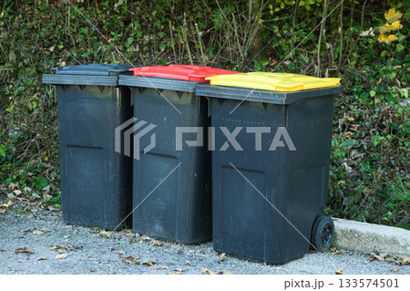 Garbage sorting in Europe. Garbage cans with colorful lids for different types of garbage 133574501