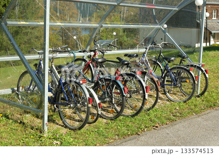 Covered Bicycle Parking with Bikes Under Shelter in Early Autumn 133574513