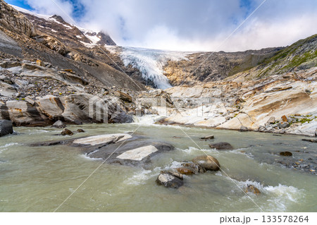 Mountain Glacier in alpine valley. Schlaten Glacier, German: Schlatenkees, Hohe Tauern National Park, East Tyrol, Austrian Alps Mountain Glacier in alpine valley. Schlaten Glacier, German: Schlatenkees, Hohe Tauern National Park, East Tyrol, Austrian Alps 133578264