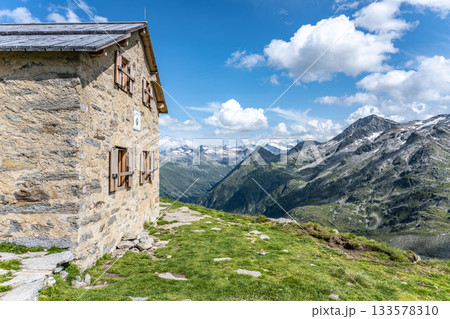 Old Prague Hut, German: Alte Prager Hutte. Small stone tourist house southeast of Grossvenediger, Hohe Tauern National Park, East Tyrol, Austria 133578310