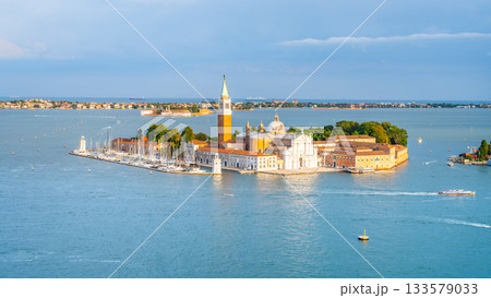Aerial view of Saint George Island, Italian: Isola San Giorgio, with Campanile San Giorgio in Venetian Lagoon, Venice, Veneto Region, Italy. Photography on sunny summer day Aerial view of Saint George Island, Italian: Isola San Giorgio, with Campanile San Giorgio in Venetian Lagoon, Venice, Veneto Region, Italy. Photography on sunny summer day 133579033