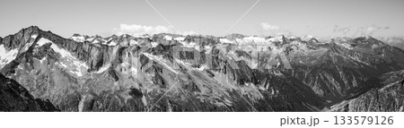 Alpnine rocky peaks panorama on sunny summer day. Austrian Alps, Austria. Black and white image. Alpnine rocky peaks panorama on sunny summer day. Austrian Alps, Austria. Black and white image. 133579126