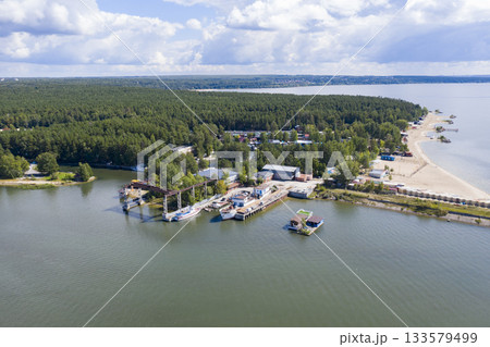 Aerial view of the pier, beach and endless forest on Ob River in summer, near Novosibirsk, Russia 133579499