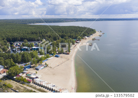 Aerial view of the beach and endless forest on the Ob River in summer 133579502