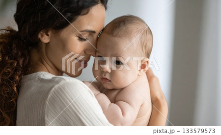 Affectionate Mother Bonding with Her Infant Child 133579573