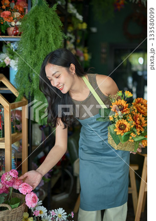 Florist woman selects flowers for making bouquet 133580099