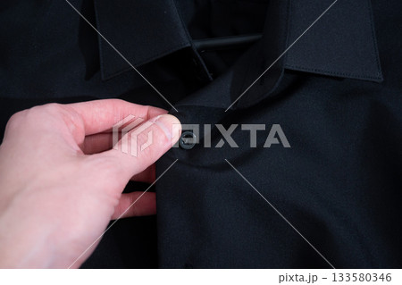 Black shirt hanging on hange Black shirt hanging on hange 133580346