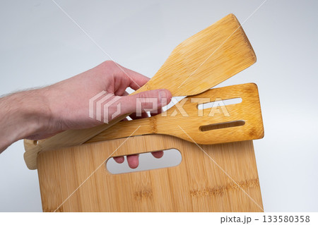 Bamboo Cutting Board with Spatulas on White Background 133580358