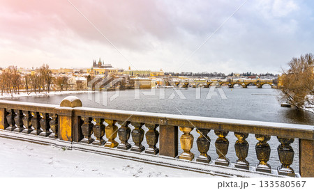Winter Prague Panoramic Cityscape with Prague Castle, Charles Bridge and Vltava River. Czech Republic Winter Prague Panoramic Cityscape with Prague Castle, Charles Bridge and Vltava River. Czech Republic 133580567
