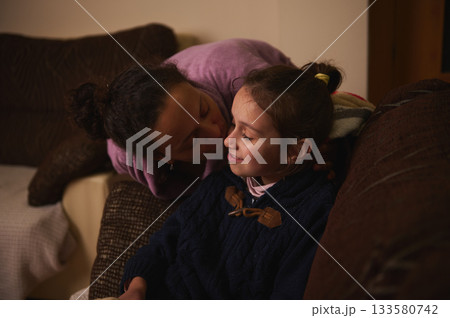 Mother And Daughter Share A Tender Moment At Home In A Cozy Living Room Mother And Daughter Share A Tender Moment At Home In A Cozy Living Room 133580742