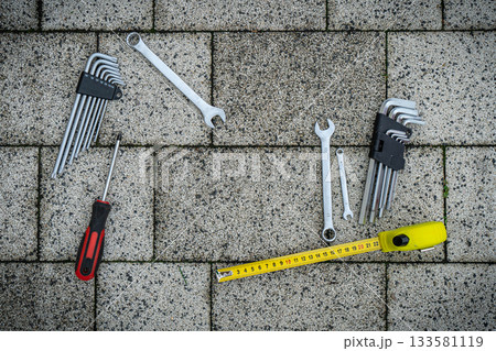 Greeting card of Fathers day. Flat set tools on stone pavement background Greeting card of Fathers day. Flat set tools on stone pavement background 133581119