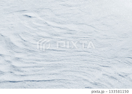 Pristine snow surface with subtle ridges and glittering frost 133581150