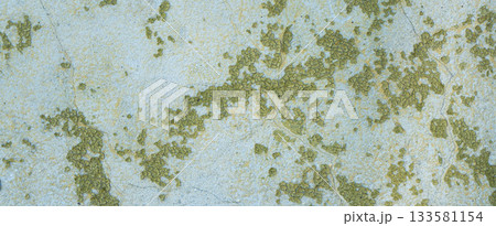 Peeling painted concrete wall, cracks of green blue and beige, peeling paint of the old rough concrete wall, peeling paint texture 133581154