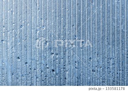 Greenhouse wall made of transparent polycarbonate is covered with water droplets Greenhouse wall made of transparent polycarbonate is covered with water droplets 133581178