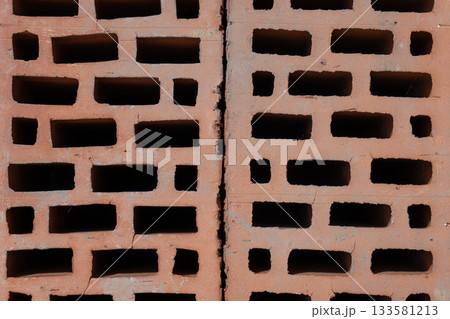 Clay red brick close-uo macro texture. Construction brick isolate on white 133581213