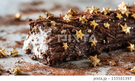 Macro photo of buche de noel adorned with textured chocolate bark, tiny edible gold stars, and cocoa powder, perfect for holiday dessert inspiration 133581397