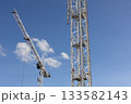 Construction Cranes Against Blue Sky 133582143