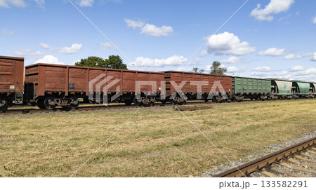 Railroad cars for transporting freight and oversized goods. Freight cars. Freight transportation by rail. Railroad cars for transporting freight and oversized goods. Freight cars. Freight transportation by rail. 133582291