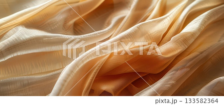 Close-up of beige textured fabric in soft light Close-up of beige textured fabric in soft light 133582364