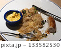 Sausage With Sauerkraut and Mustard on White Plate 133582530