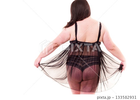Fat woman in lingerie back view. Fat woman in lingerie back view. 133582931