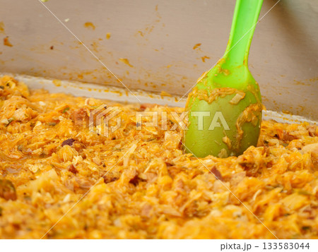 Cooked cabbage sauerkraut in big pot. 133583044