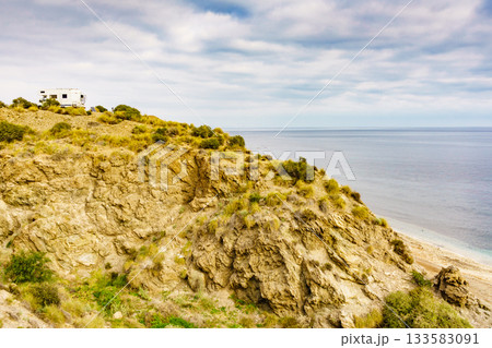Camper on cliff, coast in Spain 133583091