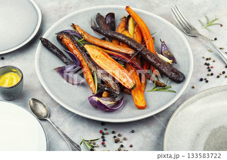 Honey glazed carrots on table. Honey glazed carrots on table. 133583722