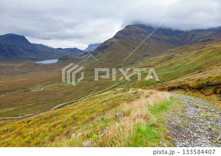 Hiking trail through Cuillin mountains on Isle of Skye Scotland UK Hiking trail through Cuillin mountains on Isle of Skye Scotland UK 133584407