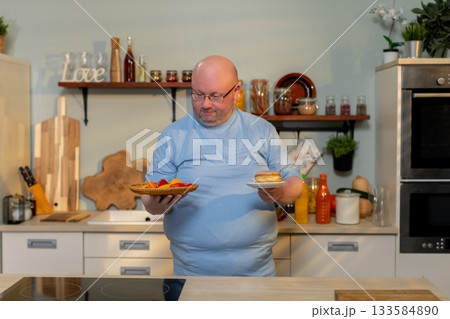 A Chef Skillfully Holding and Presenting Delicious Food in a Modern Kitchen Environment 133584890