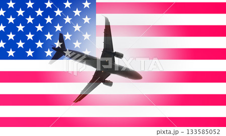A plane is flying over the American flag A plane is flying over the American flag 133585052