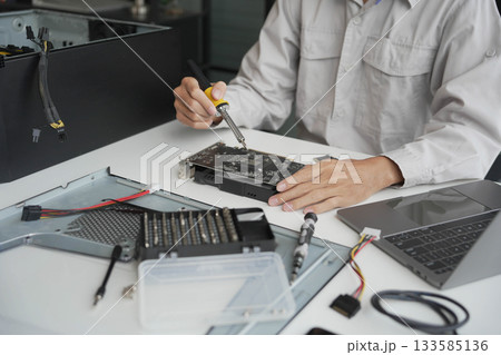 Closeup hand of computer hardware technician dissemble and  fixing computer PC. 133585136