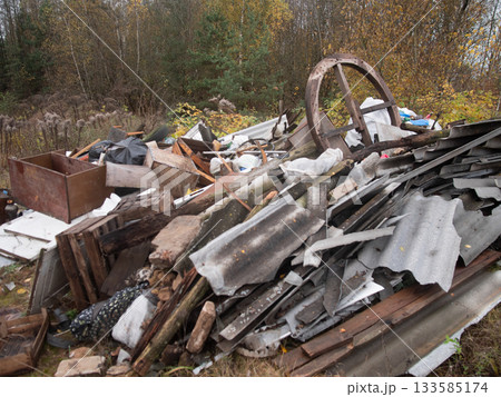 rustic scrap debris, rural scene featuring mosscovered broken roofing sheets and salvage prospects, closeup view of aged corrugated roof pieces and timber with moss and decay in rustic 133585174
