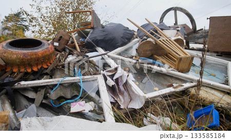 collection of construction waste including roofing and metal drums available now, wide assortment of construction debris like roofing sheets and metal drums prepared for transfer collection of construction waste including roofing and metal drums available now, wide assortment of construction debris like roofing sheets and metal drums prepared for transfer 133585184