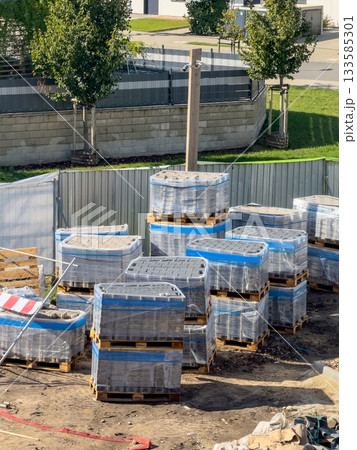 Pavement Concrete Tiles at Pallet Construction Site. Urban construction, paving slabs 133585301