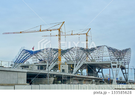 Rail Baltic station construction with cranes and steel roof structure in Riga, Latvia 133585628