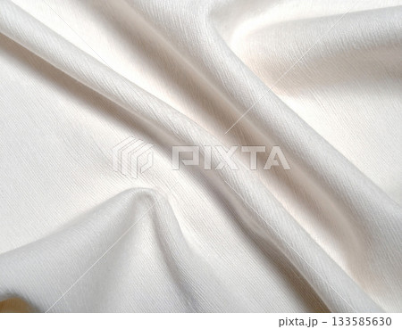 Premium branding fashion. Natural light color. Texture of premium white textile fabric. Premium cashmere material. Premium branding fashion. Natural light color. Texture of premium white textile fabric. Premium cashmere material. 133585630
