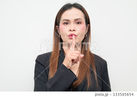 Asian Business Woman with Finger on Lips Studio Portrait on White Background Asian Business Woman with Finger on Lips Studio Portrait on White Background 133585654